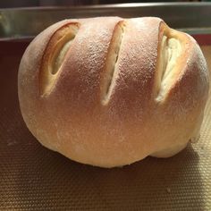 a loaf of bread sitting on top of a baking pan