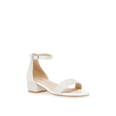 a women's white sandal with ankle straps