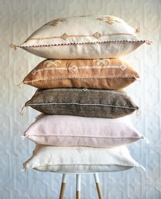 four pillows stacked on top of each other