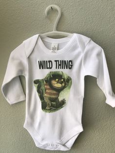 100 percent cotton One Piece Snapsuit or Bodysuit for a new baby boy or girl. I only use very high quality, thick cotton bodysuits. No cheap, flimsy, thin bodysuits here! The matching "Wild Thing" crown/hat is also sold in a separate listing. "Bodysuits" are only available up to size 18 months. After size 18 months, a short sleeved TShirt will be used to make this item for you. Size Chart for Bodysuits: 0-3 months 10 pounds 19-22" Height 3-6 months 14 pounds 22-25" Height 6-12 months 18 pounds 2 Cotton One Piece, Crown Hat, Cotton Bodysuit, New Baby Boys, Baby Boy Or Girl, Boy Baby, Girls Tshirts, Baby Fashion, New Baby Products