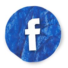 the facebook logo is shown on a blue marbled surface with white letters that read f