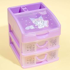 a purple toy storage box with hello kitty on it