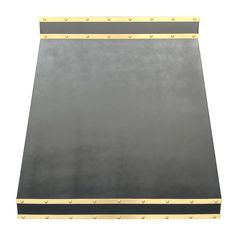 a black and gold metal surface with rivets on the edges, isolated against a white background