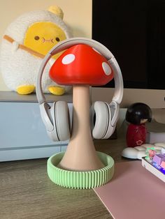 there is a mushroom with headphones on the desk