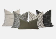 four pillows in different colors and patterns