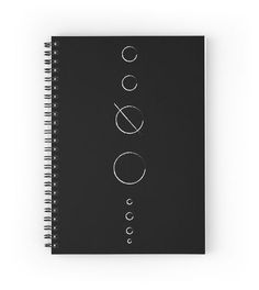 a spiral notebook with three circles on it