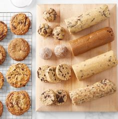 cookies, muffins and chocolate chip cookies on a cooling rack next to a baking tray