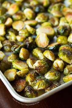 brussel sprouts in a white casserole dish