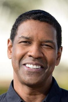 a close up of a person wearing a shirt and tie