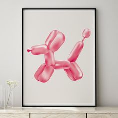 a pink balloon dog print on a white wall