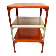 an orange and white shelf with two shelves