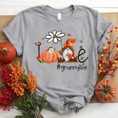 Personalized love granny life flower gnome cute Autumn T-ShirtIf you looking for a personalized t-shirt to show your love to your family, it's will be best choice. Our Classic T-Shirt serves as the perfect short-sleeved shirt for your unique, funny, or personalized designs. Features such as a lay flat collar and a classic?ÿunisex cut will make this your new favorite t-shirt. Brand: Gildan Heavy weight fabric Classic unisex?ÿmakes this an easy fit Size up if you want something roomier Our shirts Flower Gnome, Leopard Pumpkin, Turkey Shirts, Leopard Shirt, Autumn T Shirts, Personalized Grandma, Pumpkin Fall, Dark Grey Color, Personalized Clothes