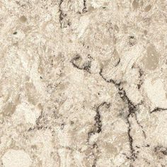 a close up view of the surface of a counter top with black and white marble