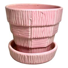 two pink planters sitting side by side on top of each other in front of a white background