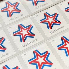 several us postage stamps with red, white and blue stars on them for the usa forever stamp