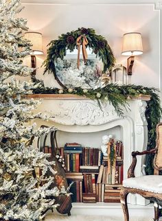 a decorated christmas tree sitting in front of a fire place next to a white fireplace