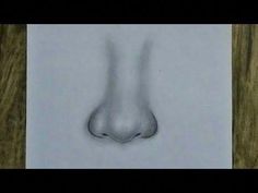 a drawing of a nose is shown on a piece of paper