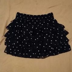 Never Worn. Can Be Worn As Waisted. Has Elastic Around The Band. Polka Dot Flowy Skirt With Ruffles, Flowy Polka Dot Skirt With Ruffles, Polka Dot Ruffled Flowy Skirt, Polka Dot Ruffled Skirt For Summer, Polka Dot Tiered Skirt With Ruffles, Casual Polka Dot Ruffled Skirt, Chic Polka Dot Ruffled Skirt, Casual Ruffled Polka Dot Skirt, Chic Polka Dot Mini Skirt