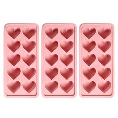 three heart shaped ice trays sitting next to each other