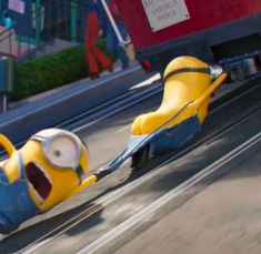 a cartoon character is pulling another character on a toy car in the movie despicable me