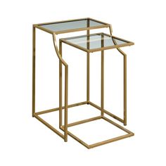 two gold metal and glass side tables with one end table on each side, the other is