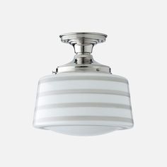 a ceiling light with a white striped shade