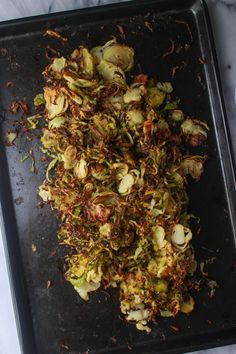 some food that is laying on a pan and ready to be cooked in the oven