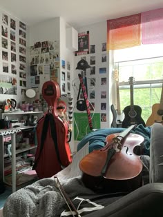 a room filled with guitars and other musical instruments