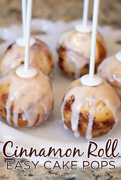 cinnamon roll cake pops on a white plate