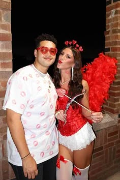 a man and woman dressed up in costumes