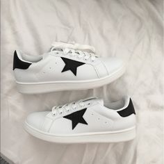 Nwt White Lace Up Sneakers With Black Star On The Sides . Really Cute. Size 5. Offers Welcome Black And White Star Shoes, Sporty White Sneakers With Star Patch, White Lace-up Sneakers With Appliques, Black And White Lace-up Synthetic Sneakers, Casual Lace-up Sneakers With Star Print, Qupid Shoes, Black Stars, Lace Up Sneakers, White Trainers