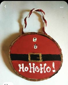 a wooden ornament with the word hollolo painted on it