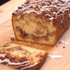 a loaf of cake sitting on top of a wooden cutting board