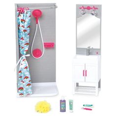 a toy bathroom with shower, sink and mirror on the wall next to it's accessories