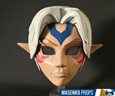 the mask is made to look like he has white hair and blue eyes, with horns on