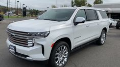 a white suv parked in a parking lot