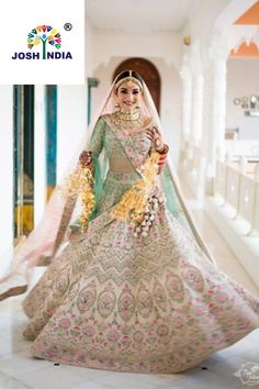 a woman in a bridal gown is posing for the camera