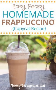 a cup of iced coffee sitting on top of a wooden table with the words easy peasy homemade frappuccino copycat recipe