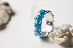 Beautiful ring Wave will bring you back to the sea! This ring is unique! Using hot enamel technique every item receives his own unique texture! https://www.etsy.com/listing/559371911/ - Wide wave ring (10 mm) Details: Width: 5mm Thickness: 1.2 mm Materials: sterling silver 925, hot vitreous enamel These rings in gold: https://www.etsy.com/listing/932462309/ - Gold blue wave https://www.etsy.com/listing/932465221/ - Gold green wave Please provide me size of the ring during the order, thank you! T Ocean-inspired Promise Ring, Ocean-inspired Sterling Silver Jewelry For Wedding, Ocean-inspired Sterling Silver Jewelry For Weddings, Ocean-inspired Round Ring For Anniversary, Ocean-inspired Blue Ring For Gift, Ocean-inspired Blue Ring For Gifts, Ocean-inspired Blue Rings As Gifts, Handmade Ocean-inspired Rings, Ocean-inspired Blue Jewelry For Anniversary