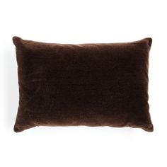 a dark brown pillow on a white background with no one in the photo to describe it