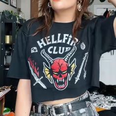 Stranger Things Netflix Hellfire Club Unisex 100% Cotton Relaxed Fit Crew Neck Tee Shirt Nwt Tag Size Is A Men's Large, So It Fits A Little Oversized On The Ladies. It's Super Cute If You Cut It To Turn It Into A Crop Top (See Pics!) This One Has Not Been Cut, That's Just A Cute Idea. This T-Shirt Is Brand New With Tags, Never Worn, And In Perfect Condition. Fast Shipping! I Typically Provide Same Day Or Next Day Shipping. Edgy Halloween Graphic Print Tops, Edgy Short Sleeve Halloween Tops, Edgy Cotton Tops For Halloween, Edgy Red Cotton Tops, Red Edgy Cotton Tops, Red Cotton Edgy Tops, Cotton Band Merch Tops For Halloween, Halloween Cotton Band Merch Tops, Punk Style Red Tops With Letter Print