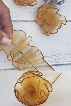 someone is working on something that looks like organes or flowers with scissors and thread