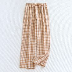 Elevate your loungewear collection with Ever Lasting's Plaid Washed Cotton Pajama Pants. Made from soft, breathable washed cotton, these pants provide both comfort and style for your relaxation time. The classic plaid pattern adds timeless charm, making them perfect for lounging at home or enjoying a cozy night in. Featuring an elastic waistband and relaxed fit, these pajama pants ensure optimal comfort as you unwind after a long day. Treat yourself to the ultimate in comfort and style with our Plaid Washed Cotton Pajama Pants. Features: Relax Fit Premium Quality Stretchy Waistband Breathable (great for all seasons) 100% Cotton Great Gift! Sizes: Small/Medium: Pant Length 38 in (96cm), Waist 42 in (106cm), Hip 25 in (63cm) Medium/Large: Pant Length 39 in (99cm), Waist 44 in (112cm), Hip 26 Summer Cotton Pants For Relaxation, Cotton Bottoms For Summer Relaxation, Relaxed Cotton Wide Leg Pants For Loungewear, Cotton Pants For Summer Relaxation, Relaxed Cotton Loungewear Bottoms, Comfy Cotton Bottoms For Relaxation, Comfortable Cotton Wide Leg Pants With Elastic Waistband, Full Length Cotton Bottoms For Loungewear, Cotton Trousers Sleepwear For Spring