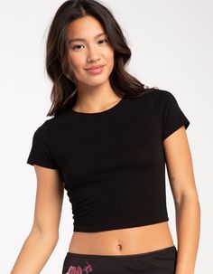 Tilly's Baby Tee. A Versatile And Stylish Staple. Solid Wash. Scoop Neckline. Short Sleeve. Fitted Silhouette. Cropped Fit. 95% Cotton, 5% Spandex. Machine Wash. Imported. Model Is Wearing A Size Small. Model Measurements:height: 5'6" Bust: 32"waist: 26"hips: 35" | Tillys Baby Tee Black Baby Tee Outfit, Clothing Necessities, Uni Fashion, Bday Wishlist, Flannel Sweatshirt, Personal Things, T Shirt Crop Top, Clothing Staples, 21 Savage