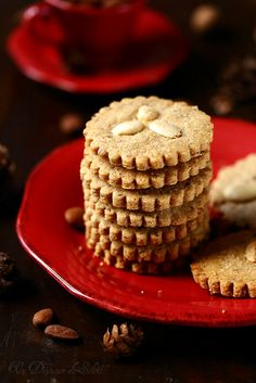 three cookies stacked on top of each other on a red plate