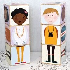 two wooden blocks with people on them sitting next to each other in front of a white background