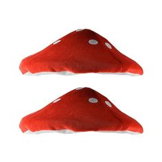 two red pillows with white polka dots on the bottom and one is shaped like a mushroom