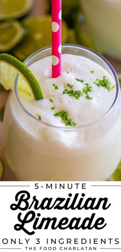 a close up of a drink in a glass with a straw and garnish