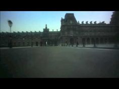 a blurry photo of a large building with a clock tower