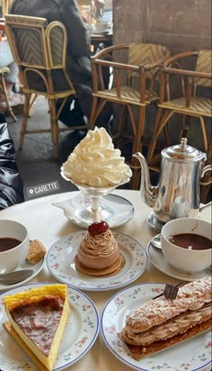 desserts and coffee are sitting on the table